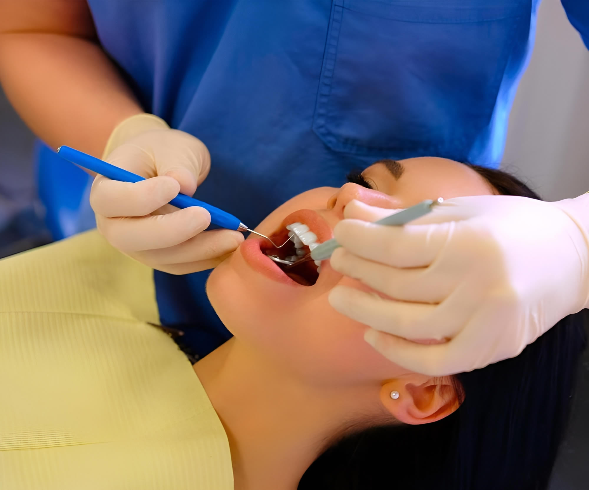 a woman getting her teeth checked