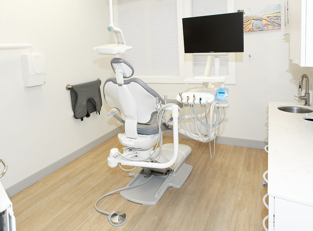 a dental chair in a room