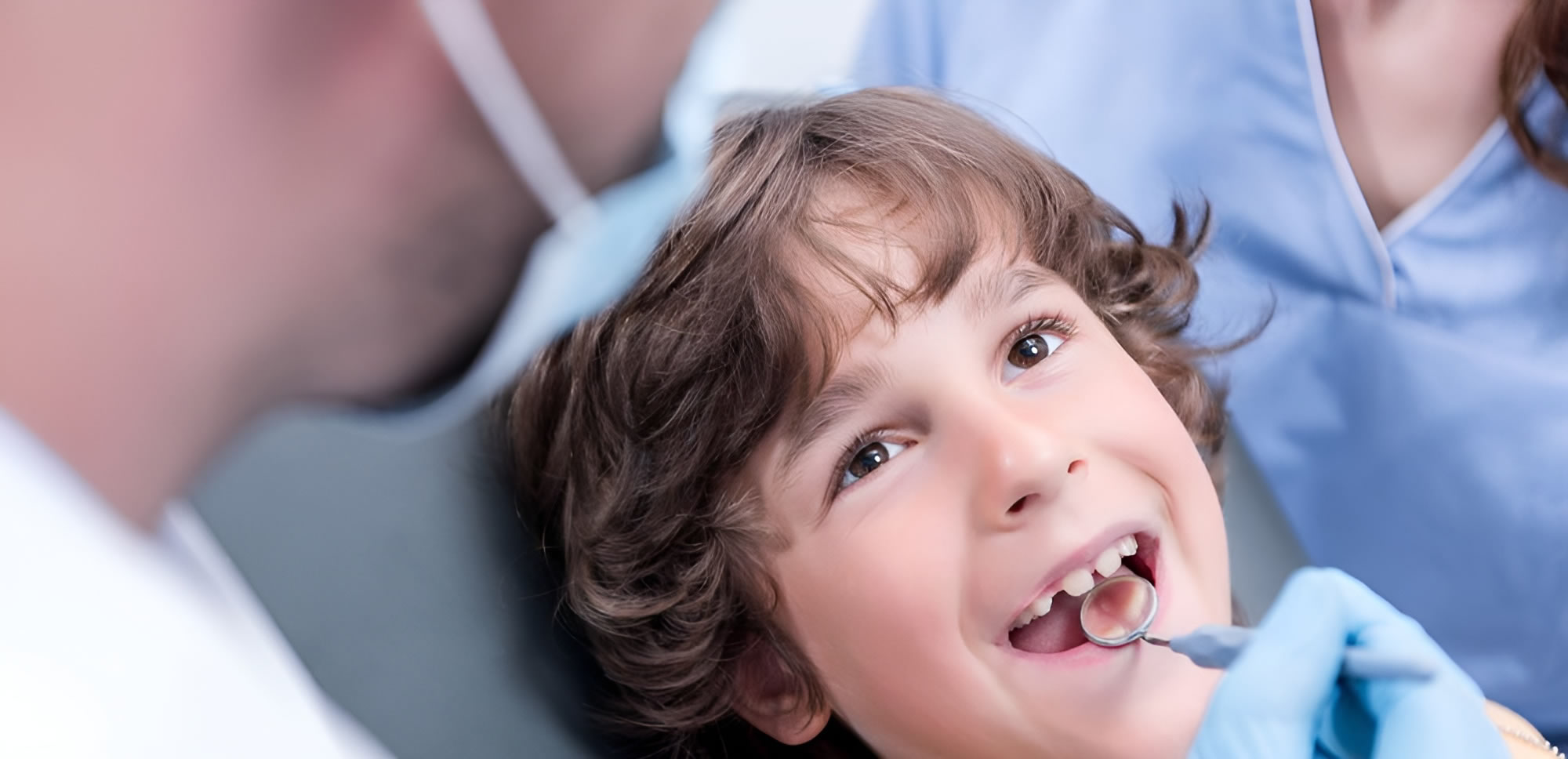 a child with a dental tool in his mouth