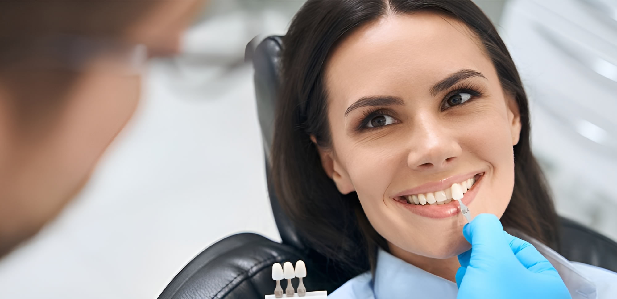 a woman smiling with a toothbrush and toothpicks